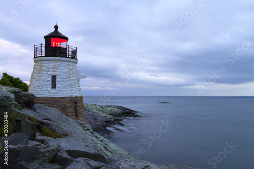 Lighthouse on a rocky shore.