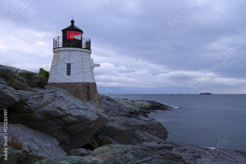 Lighthouse on a rocky shore.