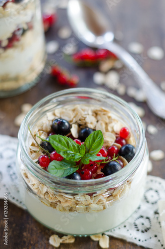 yogurt with berries and products for healthy breakfast, close-up
