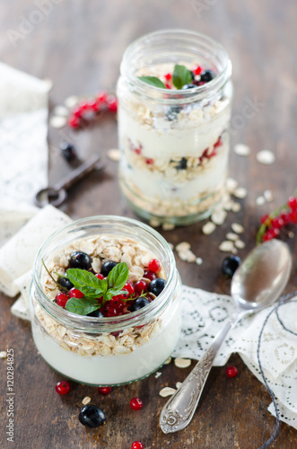 yogurt with berries and products for healthy breakfast, close-up
