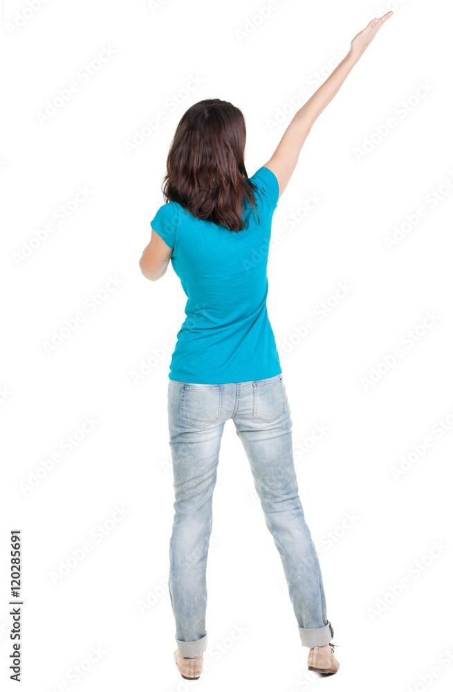 Back view of pointing woman. beautiful brunette girl in jeans. Rear view people collection. backside view of person. Isolated over white background. Back view of pointing woman. beautiful brunette girl in jeans. Rear view people collection. backside view of person. Isolated over white background.