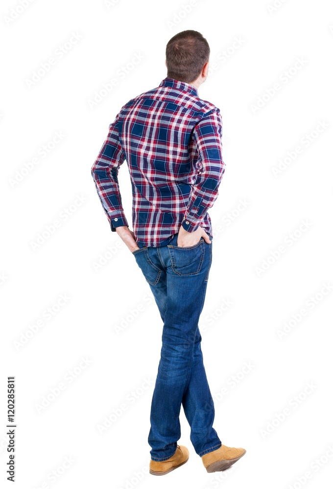 Back view of handsome man in checkered shirt looking. Standing young guy in jeans. Rear view people collection. backside view of person. Isolated over white background. Back view of handsome man in checkered shirt looking. Standing young guy in jeans. Rear view people collection. backside view of person. Isolated over white background.