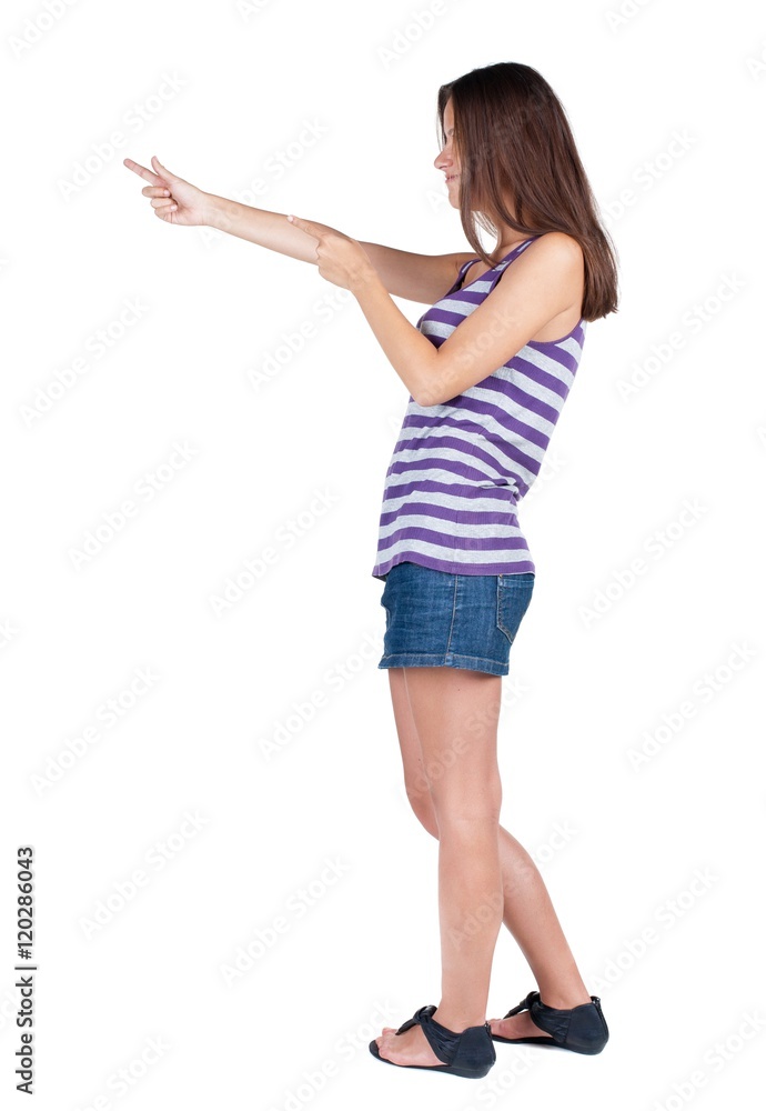 Back view of pointing woman. beautiful brunette girl. Rear view people collection. backside view of person. Isolated over white background. Back view of pointing woman. beautiful brunette girl. Rear view people collection. backside view of person. Isolated over white background.