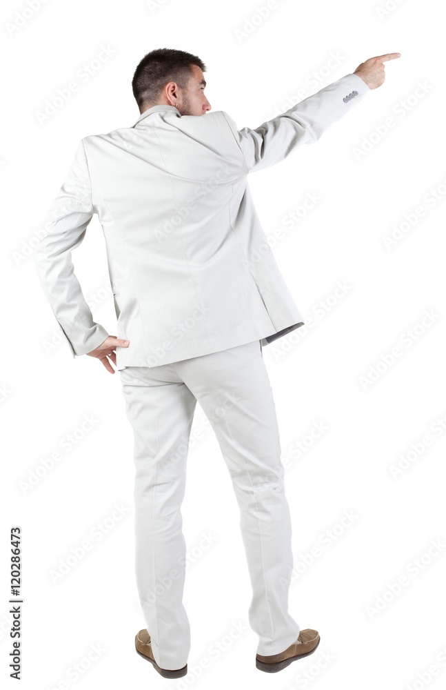 Businessman pointing at wall. rear view. Isolated over white . Businessman pointing at wall. rear view. Isolated over white .