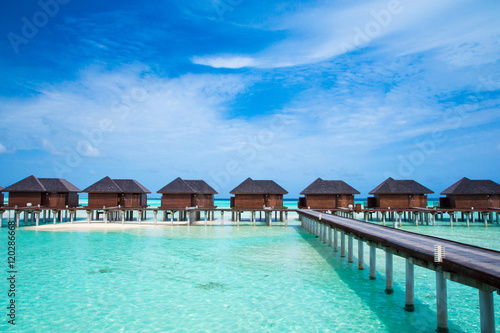 beach with water bungalows at Maldives