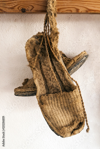 Alpargatas de esparto. Calzado antiguo hecho de esparto para trabajar en el campo en las labores de labranza y pastoreo photo