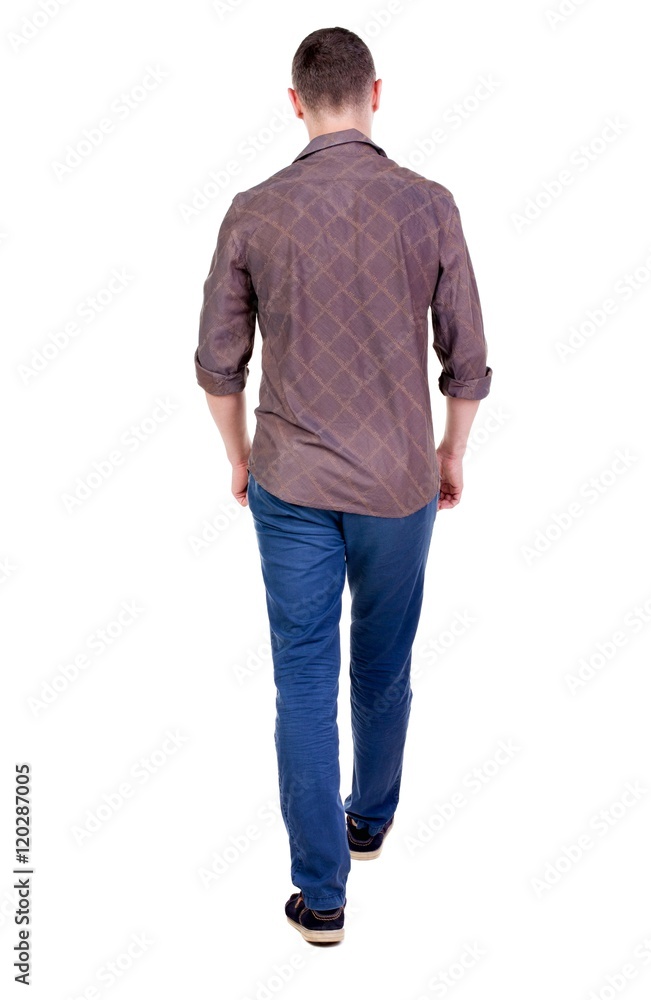 Back view of going handsome man in jeans and a shirt. walking young guy . Rear view people collection. backside view of person. Isolated over white background. Back view of going handsome man in jeans and a shirt. walking young guy . Rear view people collection. backside view of person. Isolated over white background.