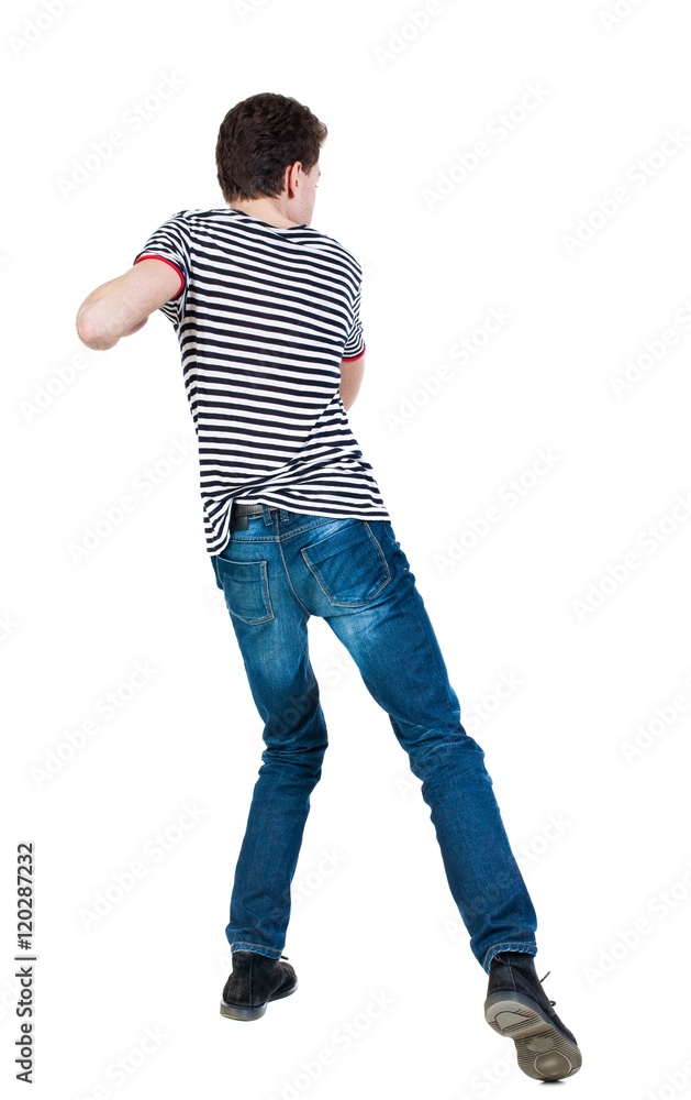 back view of skinny guy funny fights waving his arms and legs. Isolated over white background. Rear view people collection. backside view of person. Funny guy clumsily boxing. The guy in the striped back view of skinny guy funny fights waving his arms and legs. Isolated over white background. Rear view people collection. backside view of person. Funny guy clumsily boxing. The guy in the striped