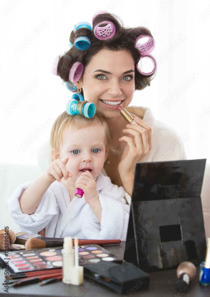 Mother and daughter are doing hair, manicures, makeup, having fun. Mother and daughter are doing hair, manicures, makeup, having fun.
