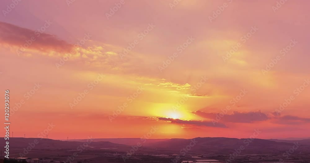 sunset scene with sun fall behind the clouds in background, time lapse shot, warm colorful sky with soft clouds . sunset scene with sun fall behind the clouds in background, time lapse shot, warm colorful sky with soft clouds .