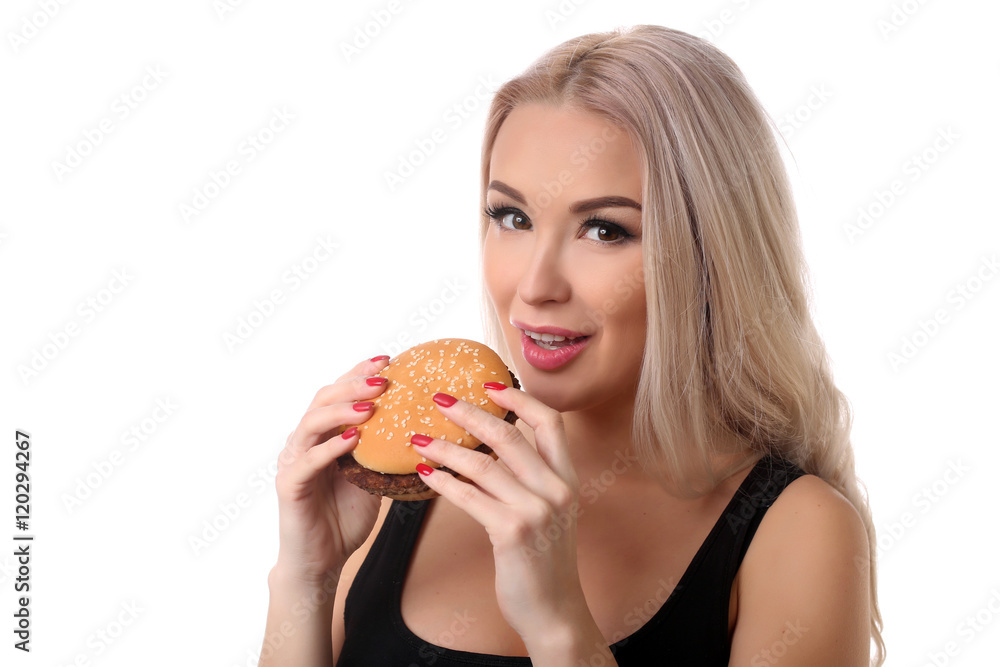 Woman eating hamburger. Close up. White background