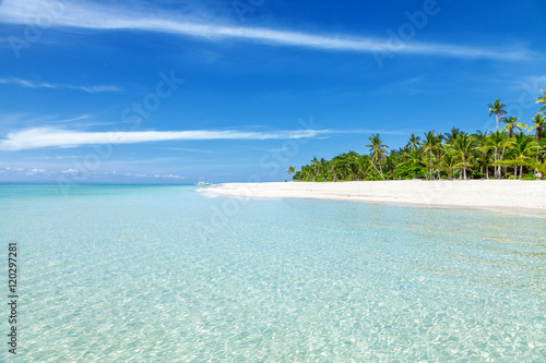 Fantastic turquoise beach with palm trees and white sand