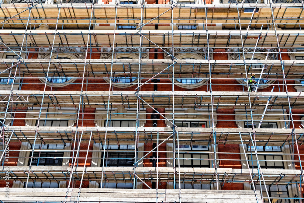 Fragment of scaffolding against house wall in Central London Fragment of scaffolding against house wall in Central London