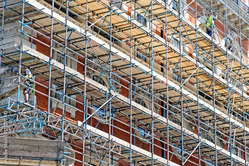 Fragment of scaffolding against house wall in Central London