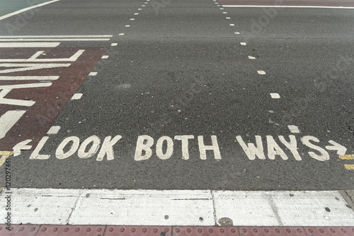 Look both ways inscription on the road.
