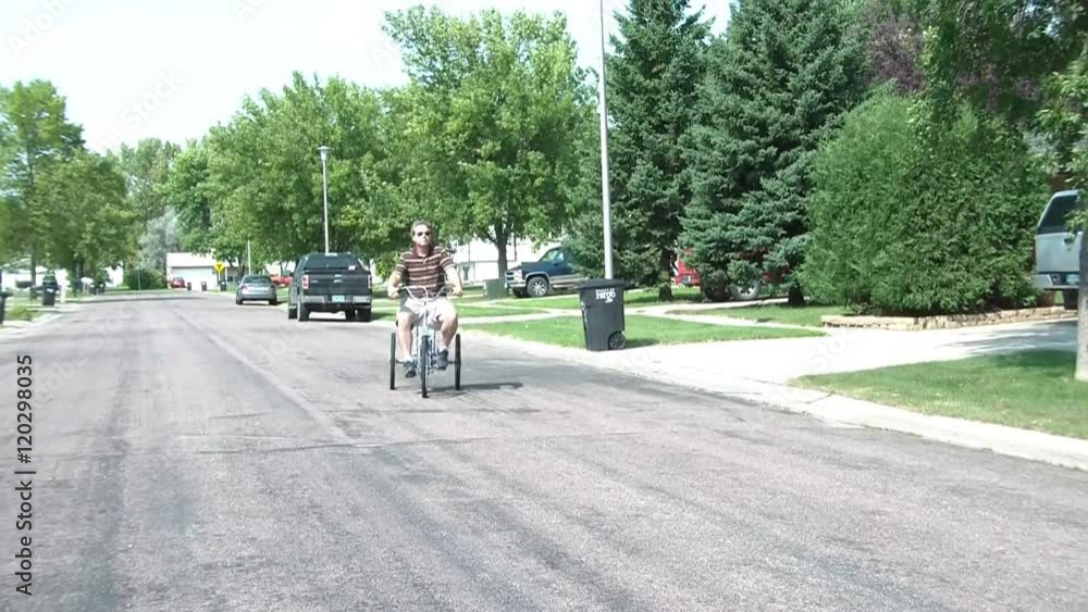 Man Riding Trycycle Bike Man Riding Trycycle Bike