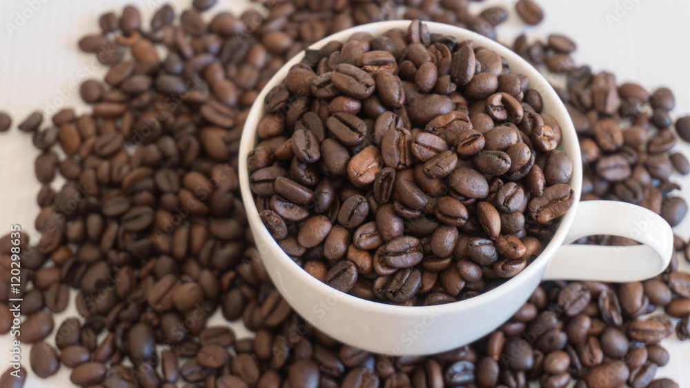 Coffee beans in coffee cup