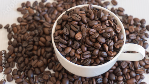 Coffee beans in coffee cup