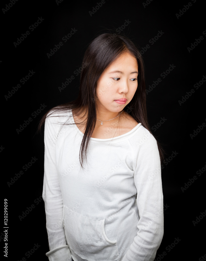 Portrait of Asian Teen Girl Posing on Black Background Portrait of Asian Teen Girl Posing on Black Background