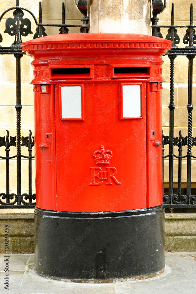 Traditional red letter box in London, England. Traditional red letter box in London, England.