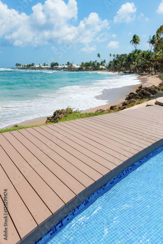 Tropical beach Tobago Caribbean nearby pool and wooden deck  © Altin Osmanaj