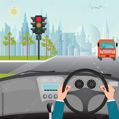 Human hands driving a car on asphalt road and waiting for the tr