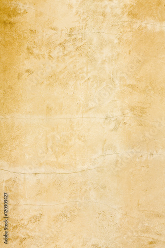 Vertical rustic gold stucco texture wall background