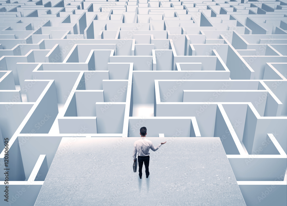 Businessman staring at infinite maze Businessman staring at infinite maze
