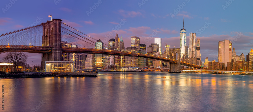Panorama of Brooklyn Bridge and Manhattan skyscrapers at sunrise