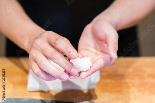 Close up hand of Japanese chef making sushi 