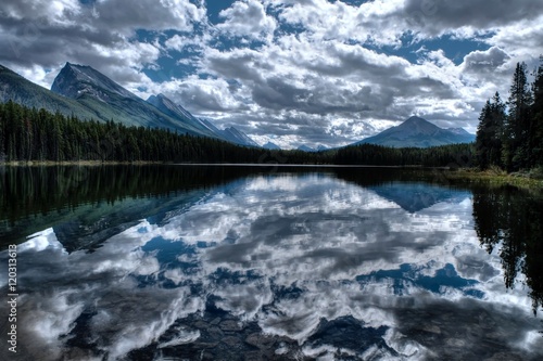 Clear water, mountains and reflections. Honeymoon lake. Banff National Park. Alberta. Canada. 