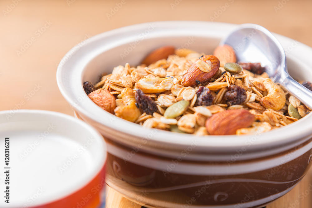 Bowl of cereal, milk, and apple Bowl of cereal, milk, and apple
