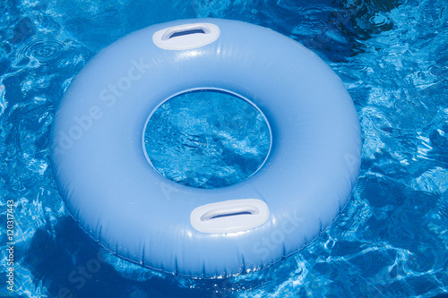 Obraz na plátně blue floater with handles in water of pool