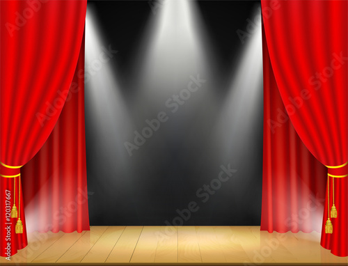 Theater stage with spotlights and red curtain.