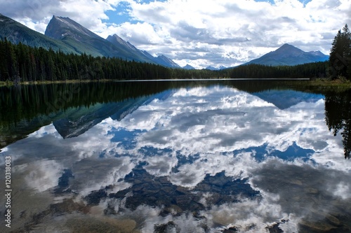 Fototapeta Naklejka Na Ścianę i Meble -  Clear water, mountains and reflections. Honeymoon lake in Canadian Rockies. Jasper National Park. Alberta. Canada. 