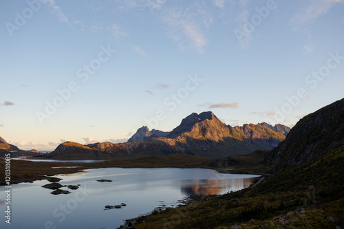 Mountain peeks illuminated by last sunlight of the day over Tors