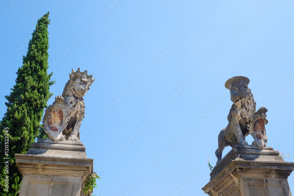 Monselice, Italy, June, 23, 2016: monument of lion in an old part of town in Monselice, Italy Monselice, Italy, June, 23, 2016: monument of lion in an old part of town in Monselice, Italy