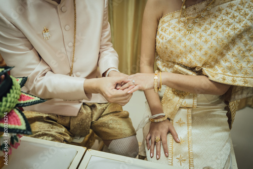 Photography thai wedding, putting the wedding ring