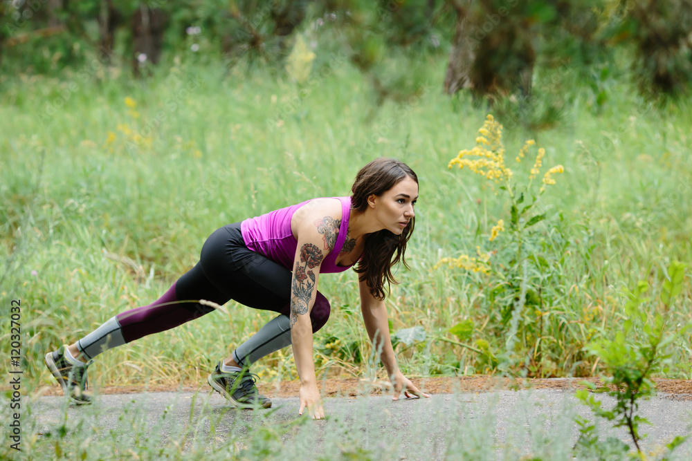 Fototapeta premium Fitness woman training and jogging in summer park near forest. R