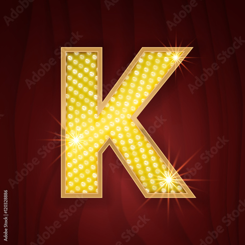 Gold light lamp bulb letter K