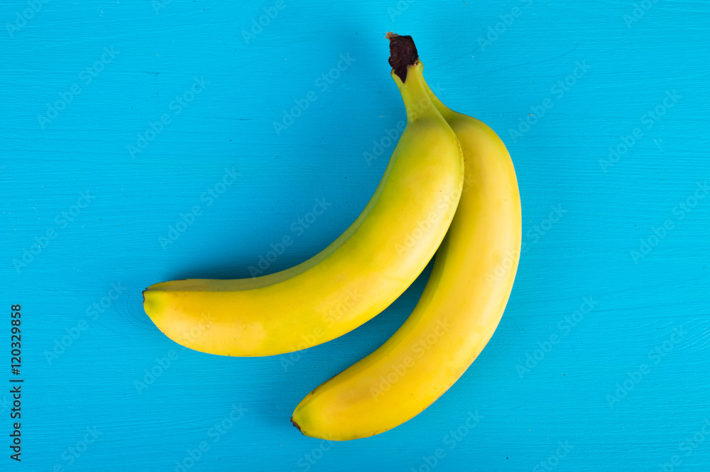 Banana bunch on a blue background Banana bunch on a blue background