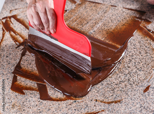 Tempering melted chocolate photo