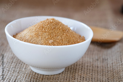 Ginger powder with sugar on sackcloth floor. © sarawutnirothon