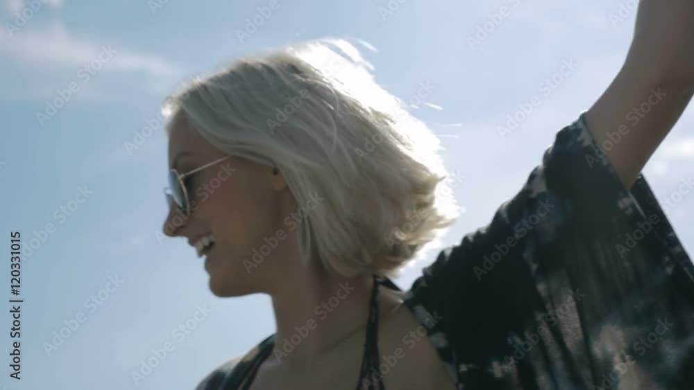 Two young happy hipster girls in sunglasses having fun, outdoor. Two pretty girlfriends smiling, laughing and fooling around during sunny day. 