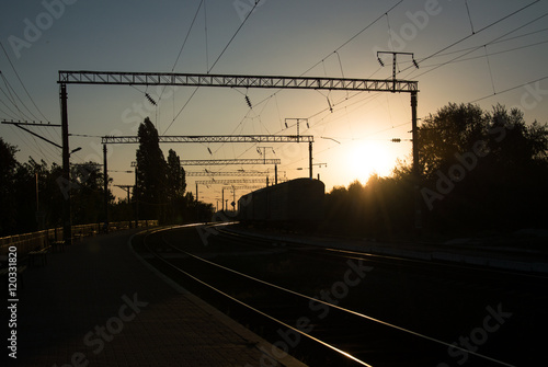Cargo train platform at sunset