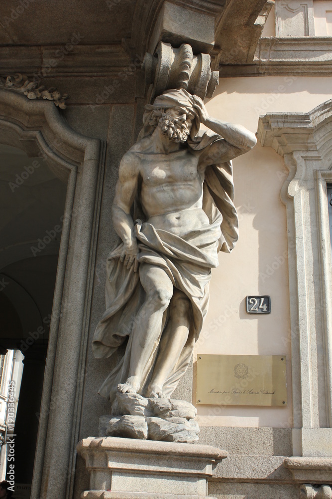 Close up of a statue at the entrance of Palazzo Litta in Milan, Italy, property of the ministry for Art and culture in Milan