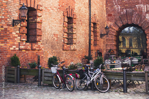 Parked bikes near outdoor cafe in Europe