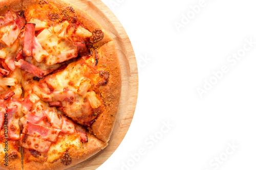 Hawaiian pizza on a wooden tray.