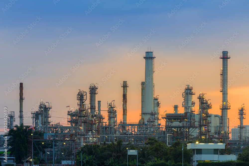 Sunrise background over petrol chemical refinery on cloudy day