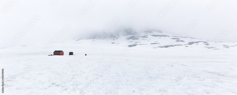 Fototapeta premium Winter view on mountain range, white cloud. Norway.